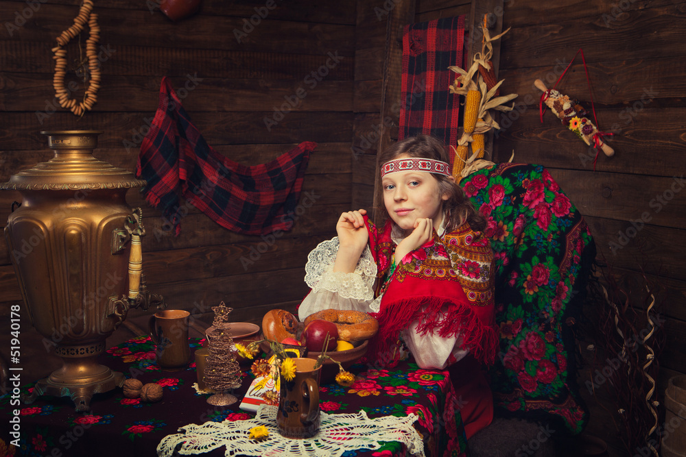 Russian beauty before Christmas in a wooden interior