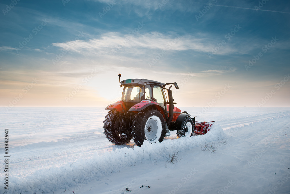 Fototapeta premium Tractor cleaning snow