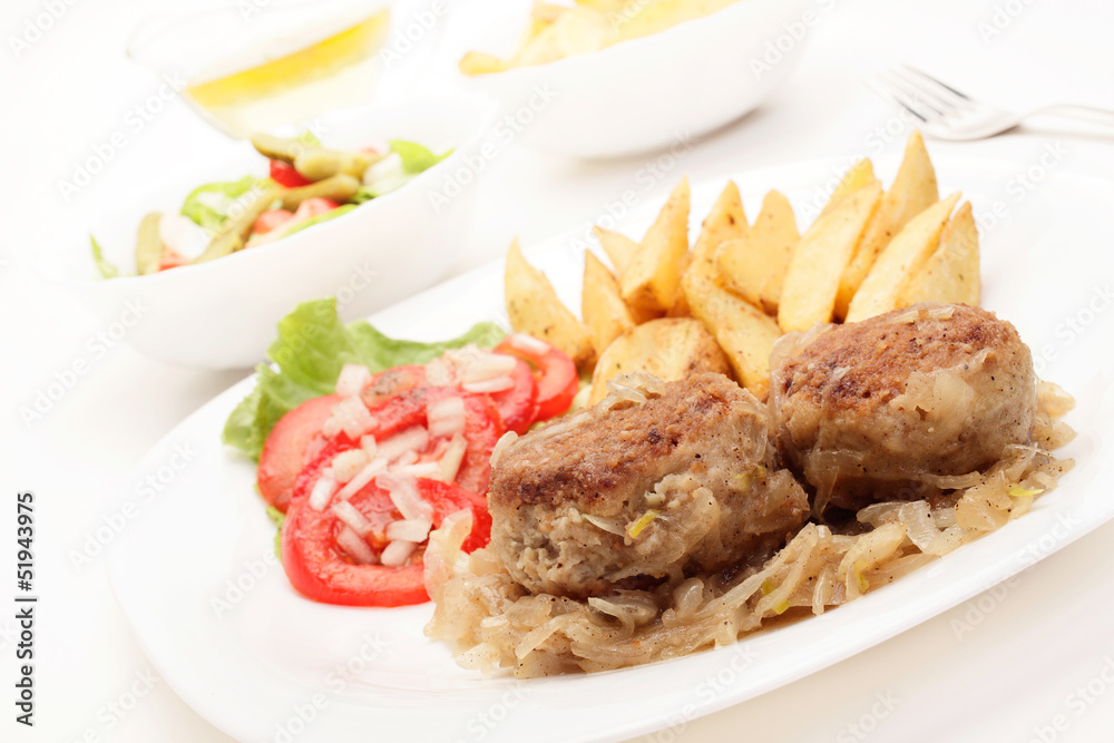 Meatballs with stewed onion and fried potato wedges Meatballs with stewed onion and fried potato wedges