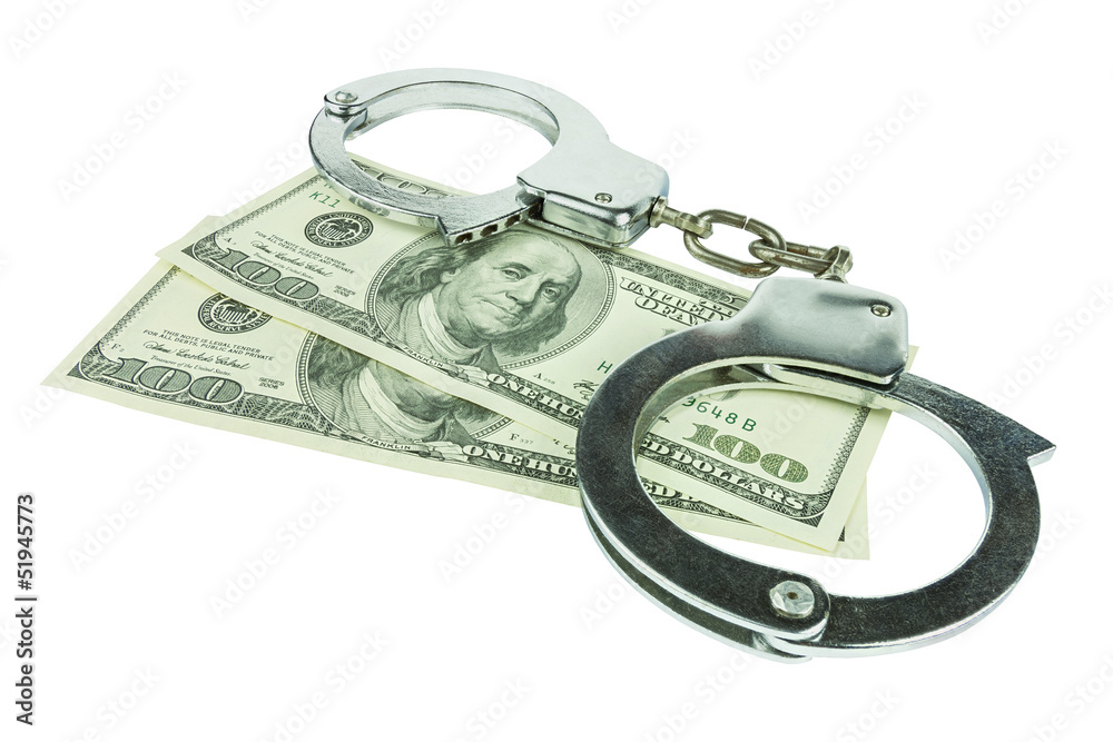 Handcuffs with money isolated in white background Handcuffs with money isolated in white background