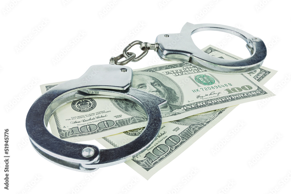 Handcuffs with money isolated in white background Handcuffs with money isolated in white background
