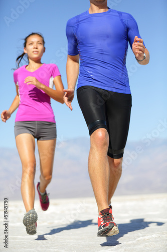People running - runner fitness couple in desert