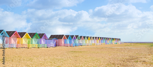 Fotografie Traditional British beach huts on a bright sunny day