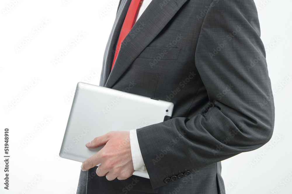 Businessman carrying digital tablet