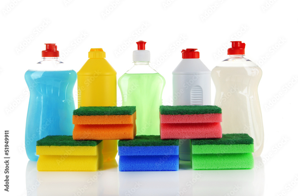 Bottles of dishwashing liquid and colorful sponges, isolated Bottles of dishwashing liquid and colorful sponges, isolated