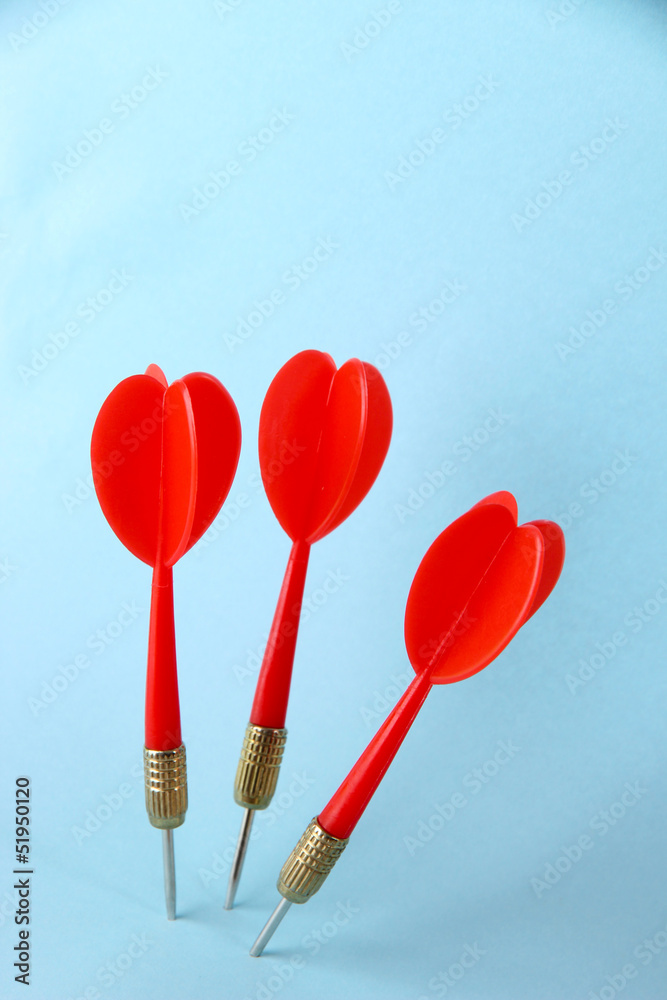Darts on blue background Darts on blue background