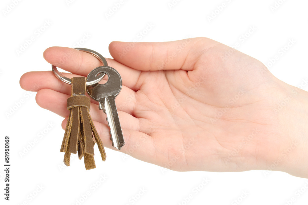 Key with leather trinket in hand isolated on white