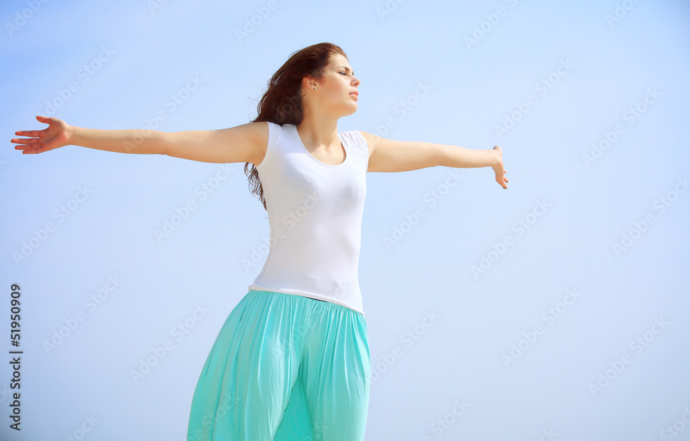 Girl on beach with raised hands, summer Girl on beach with raised hands, summer