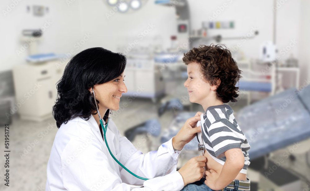Fototapeta premium Brunette pediatrician at the hospital with a baby