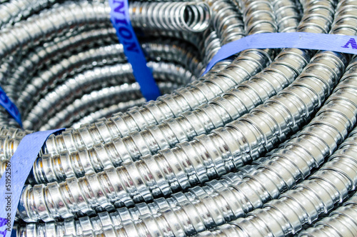 Close up Metal cable protection conduit electric line.