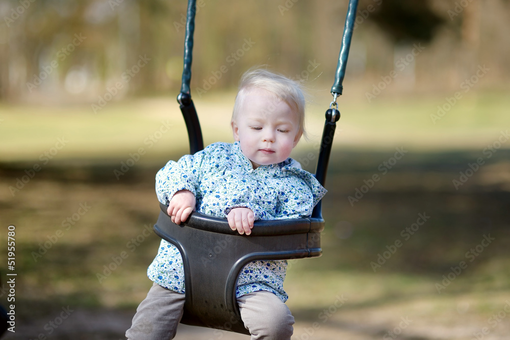 Swinging toddler having fun Swinging toddler having fun