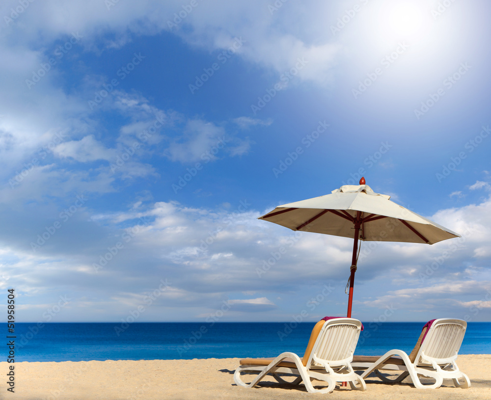 beds and umbrella on the beach