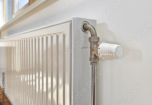 White radiator in an appartment. photo