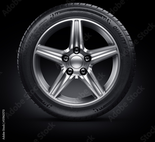 Car tire on black background