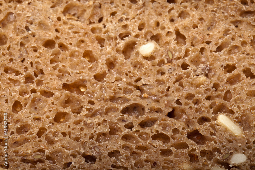 Slice of dark bread isolated over white