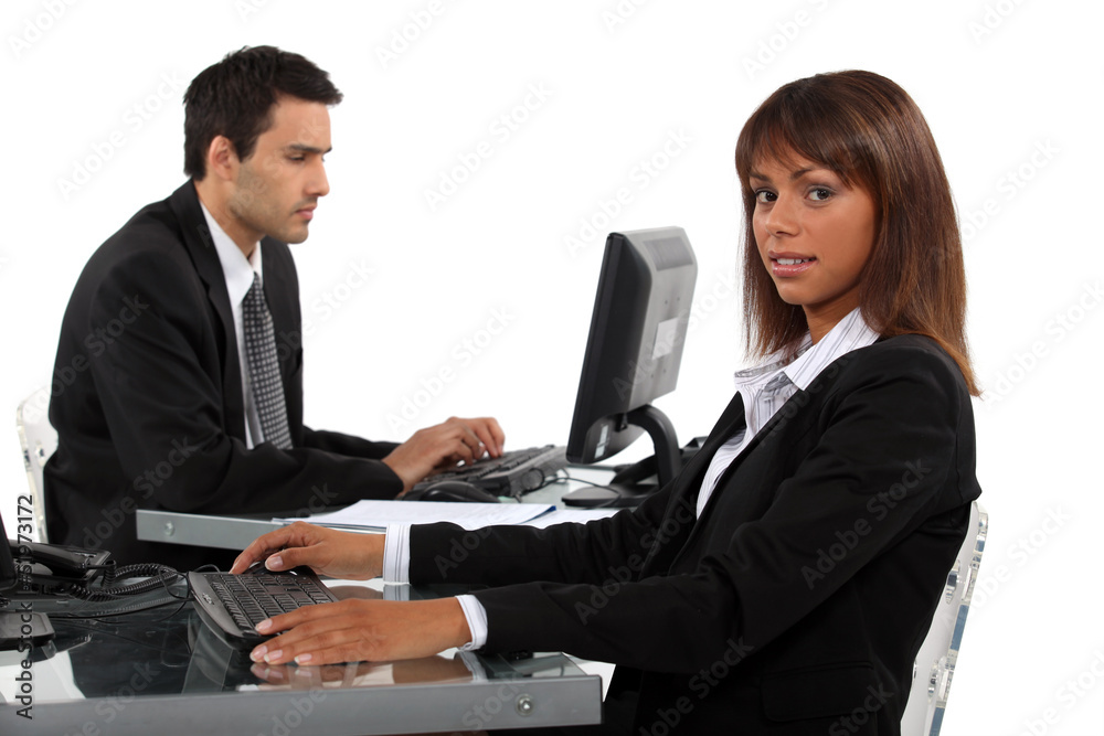 Two young business colleagues working hard Two young business colleagues working hard