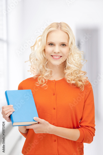 happy and smiling woman with book