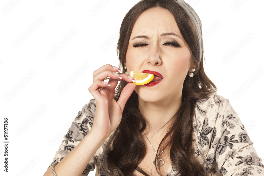 modern housewife tasting lemon and Frown modern housewife tasting lemon and Frown