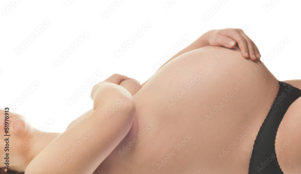 Pregnant woman with hands over tummy at white background