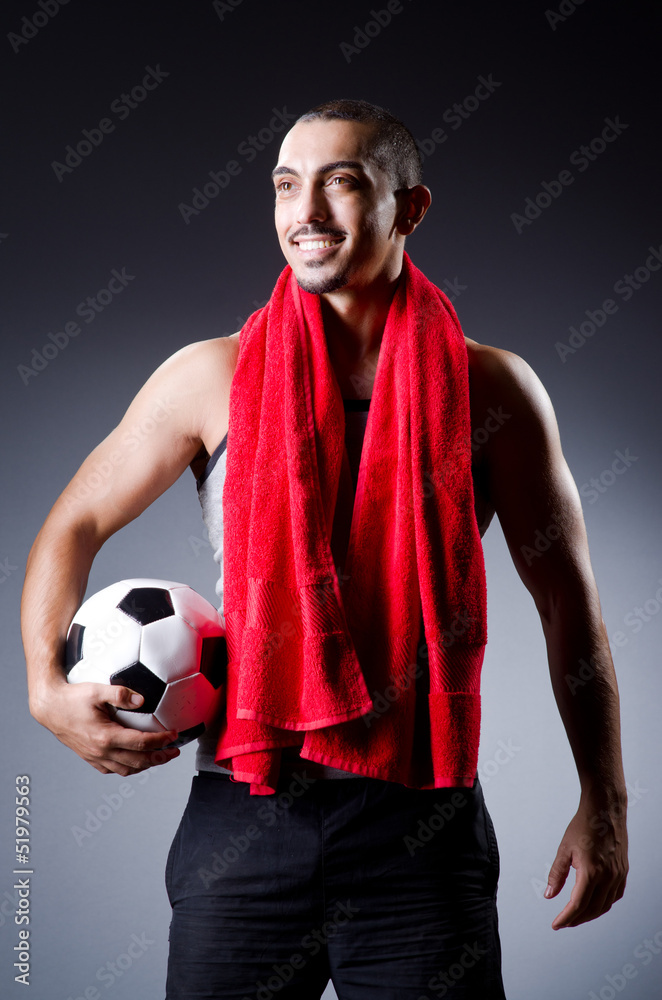 Football player with ball and towel Football player with ball and towel