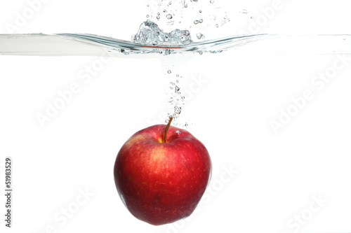 red apple in the water splash over white