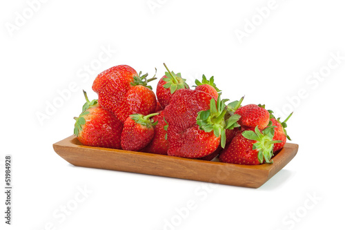 Strawberries in a bowl isolated on white