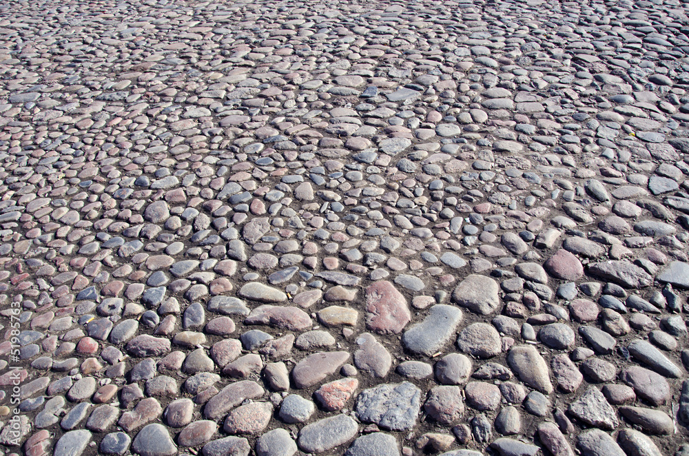 natural cobblestone sidewalk in city square natural cobblestone sidewalk in city square