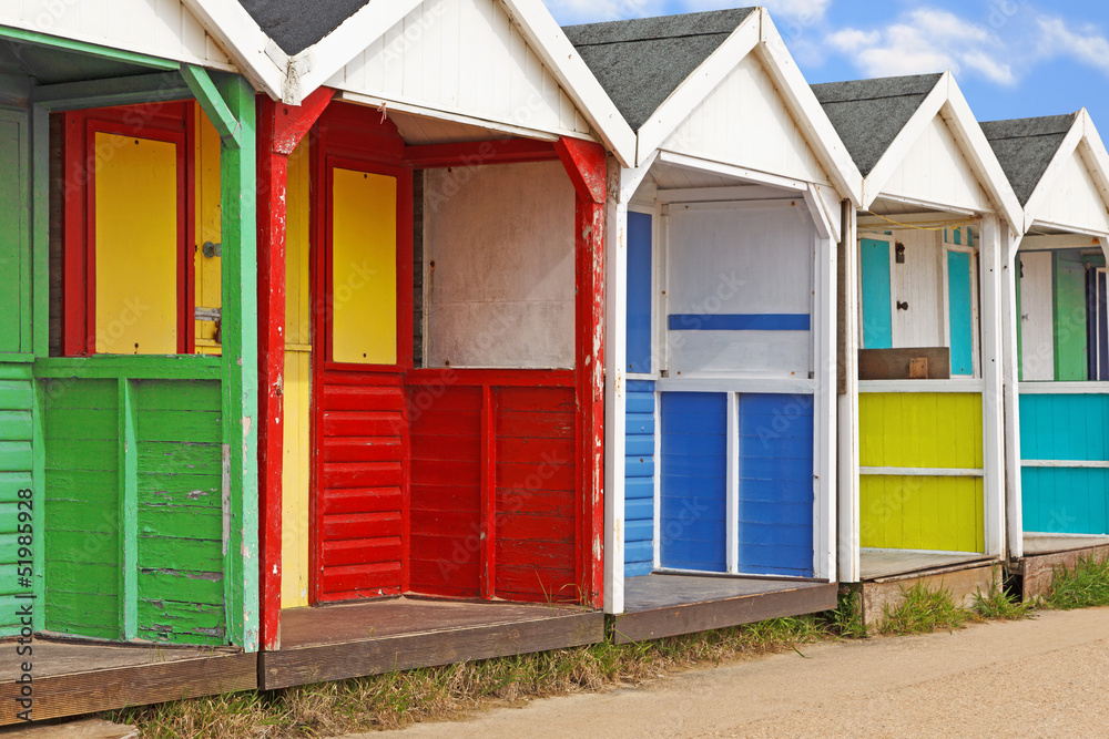 Row of old wooden beach huts