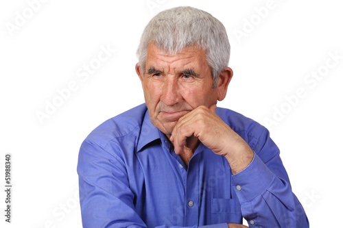 Elderly man lost in thought