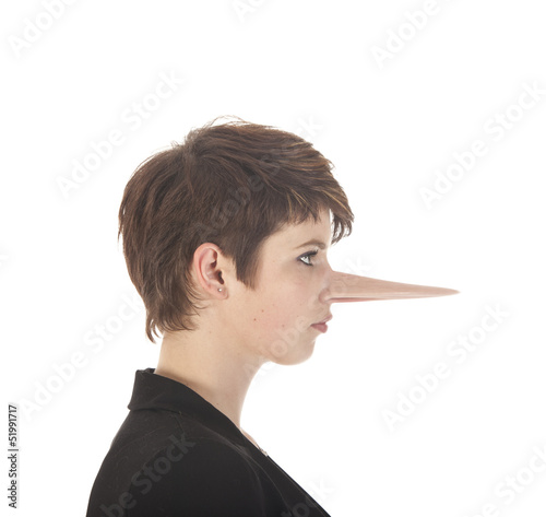 Young woman making a lie with long nose
