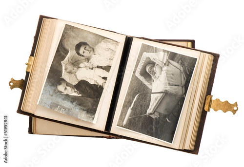 open antique album with baby photos