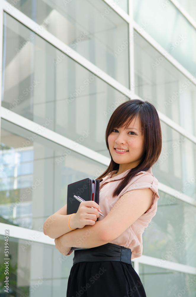 Asian female college student on campus background Asian female college student on campus background