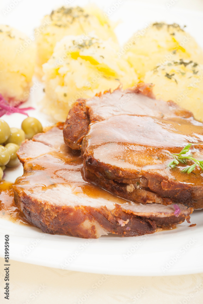 Roast pork with sauce. Selective focus. Roast pork with sauce. Selective focus.