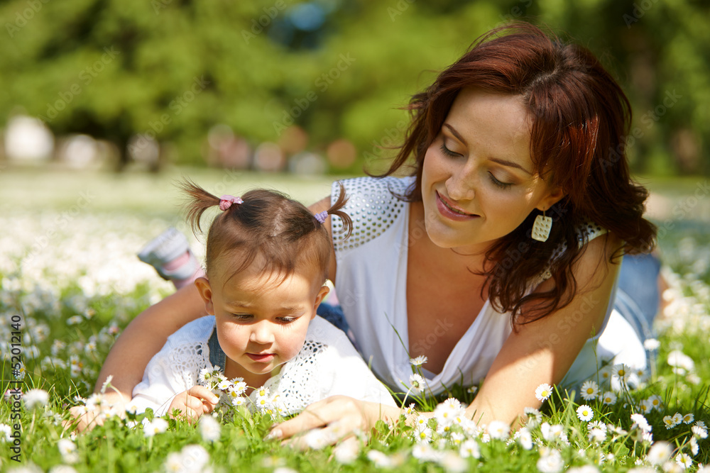 Young attractive mother with her baby Young attractive mother with her baby