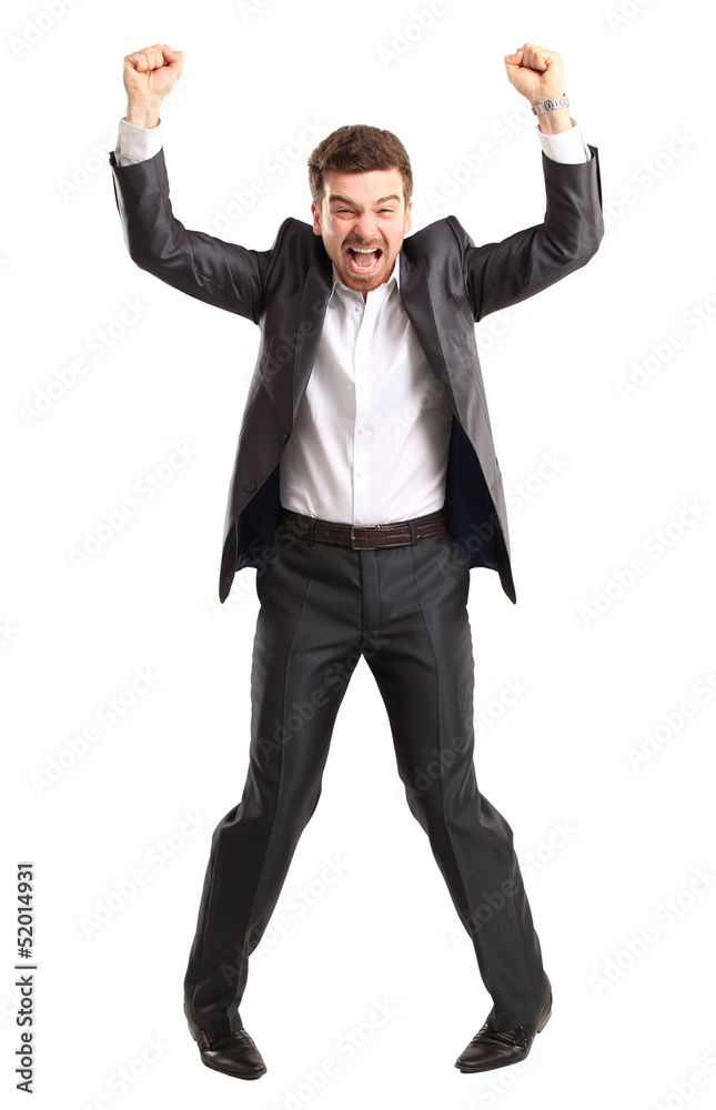 Excited handsome business man with arms raised in success Excited handsome business man with arms raised in success