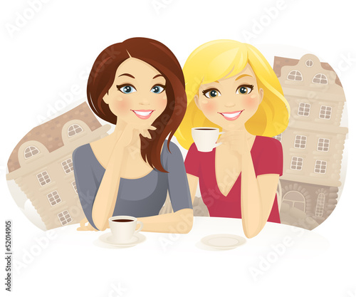 Two woman drinking coffee in street cafe