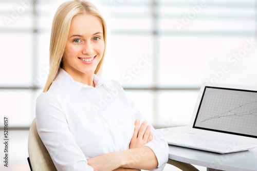 Young business woman using laptop