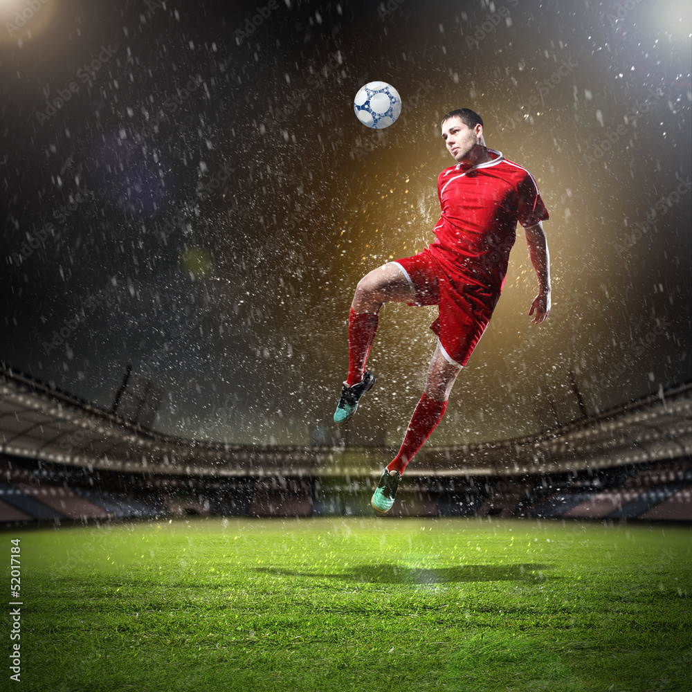 football player striking the ball