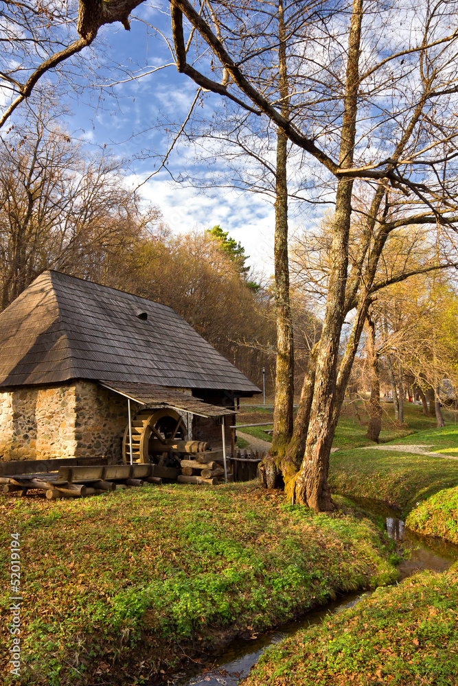 Fototapeta premium Watermill and creek in the forest