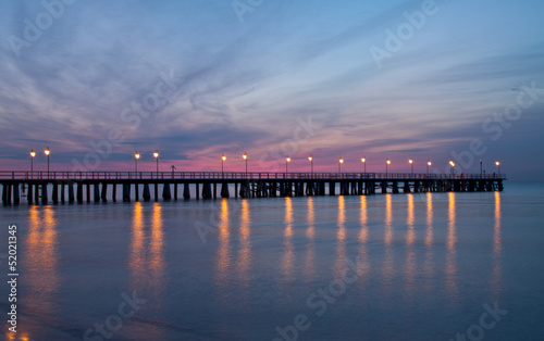 Sunrise on the pier at the seaside, Gdynia Orlowo, Poland.