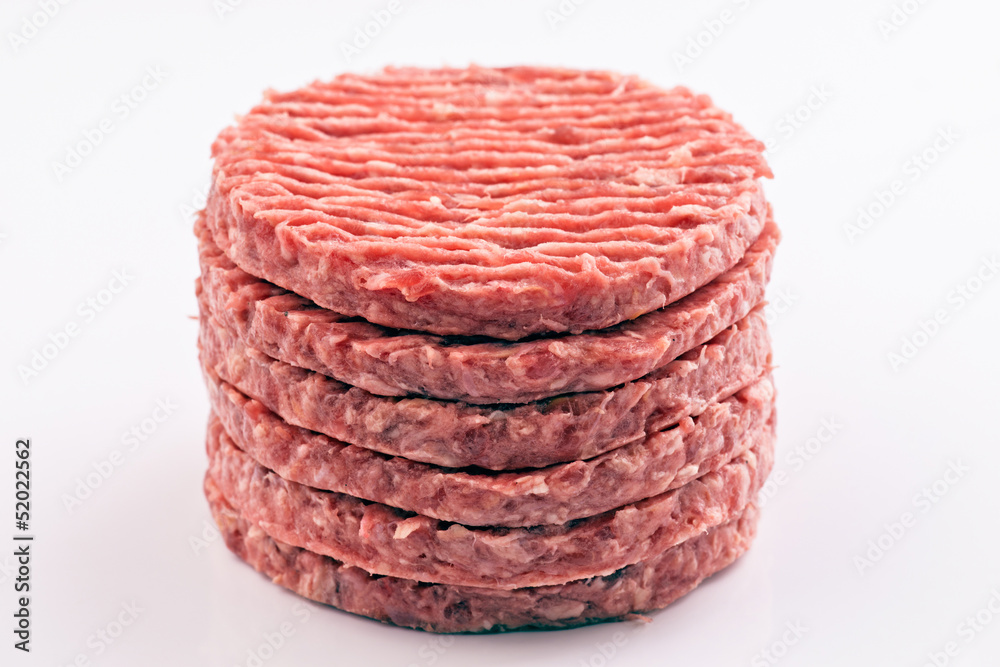 stacked raw hamburger steaks stacked raw hamburger steaks