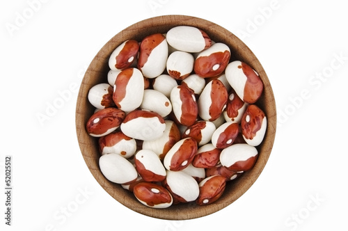 Multicolored kidney beans in wooden bowl isolated on white