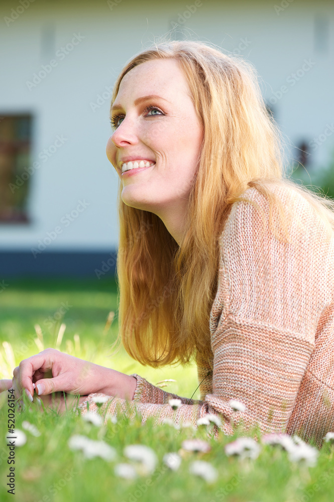 Beautiful young woman smiling and relaxing outdoors Beautiful young woman smiling and relaxing outdoors