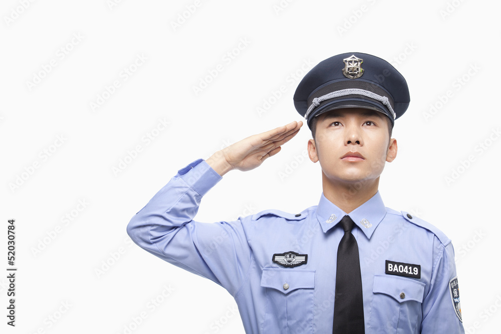 Police Officer Saluting, Studio Shot Police Officer Saluting, Studio Shot