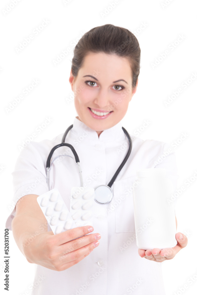 young female doctor giving pills over white young female doctor giving pills over white