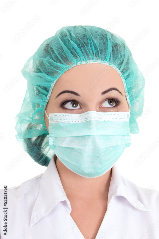 close up portrait of doctor in blue mask and cap over white close up portrait of doctor in blue mask and cap over white