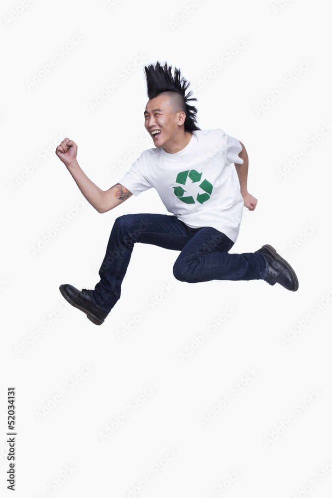 Young man with Mohawk jumping