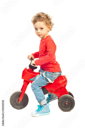 Toddler boy riding bicycle