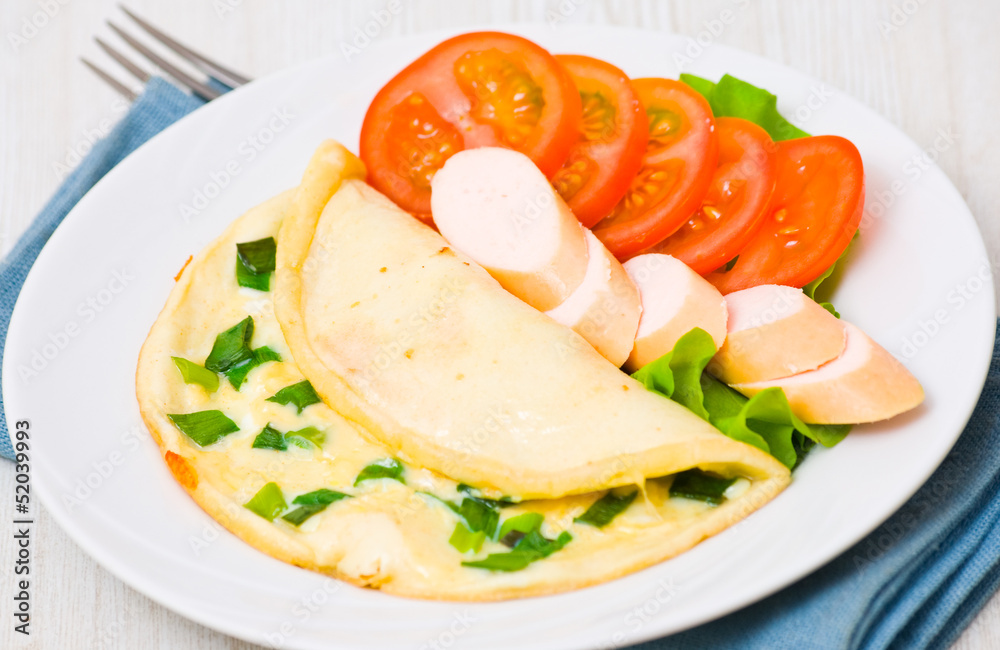 Breakfast. scrambled eggs, sausage and tomatoes Breakfast. scrambled eggs, sausage and tomatoes