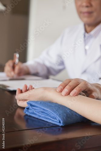 Close Up of Patient s Hand While Doctor Takes Pulse